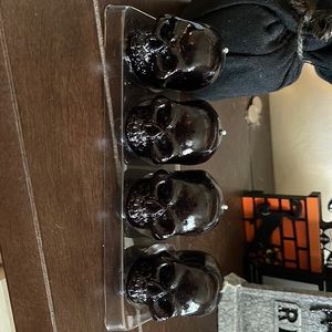 Black painted skull candles